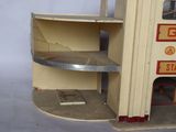 a model of a gas station on display in a room