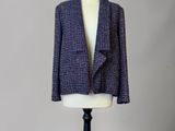 a close up of a mannequin mannequin with a jacket on it