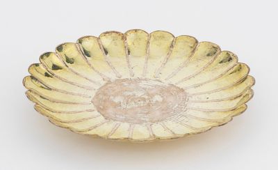 an image of a gold plate on a white background