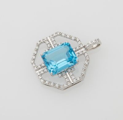 a blue topaz stone and diamond pendant