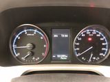 a close up of a car dashboard with various gauges