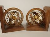 pair of antique brass globe bookends on wooden bases