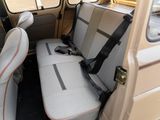 two seats in the back of a van with a seat belt