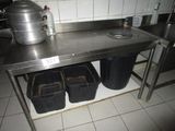 stainless steel table with two bins and a pot on top of it