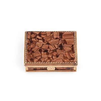 a close up of a small box with a flower design on it