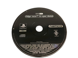 a black disc with a game on it on a white surface
