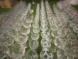a lot of empty wine glasses sitting on a table