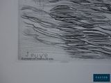 a black and white drawing of a wave on a white wall