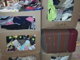 boxes of luggage are stacked on top of each other in a warehouse