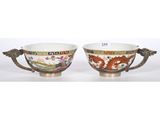 a pair of chinese bowls with dragon handles