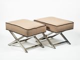 pair of stools with foot rest and cushion on each side