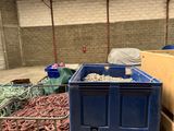 a blue container filled with lots of different types of rope
