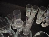 a lot of glasses that are sitting on a table