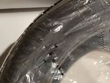 a close up of a toilet with a plastic cover on it