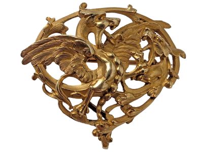 an image of a gold brooch with a bird on it ' s back
