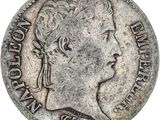 une pièce d'argent portant une tête de femme