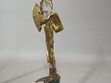 bronze statue of a woman holding a fan on a marble base