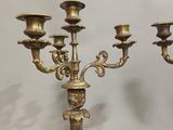 three candles that are sitting on a table