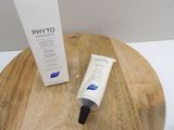 a tube of phyto on a table next to a tube of phyto