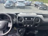 many cars parked in a parking lot with a steering wheel