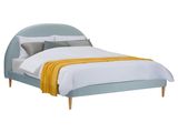 une image représentant un lit avec une tête de lit bleue et une couverture jaune