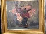 a painting of flowers in a vase on a easel