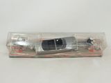 an image of a toy car in a clear box on a white surface