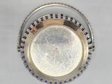 an image of a silver plate with a blue and white design on it