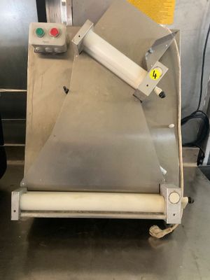 a machine that is sitting on a table in a kitchen