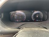a close up of a car dashboard with a speedometer and gauges