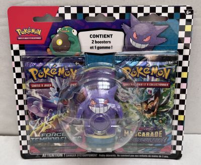the box contains a toy figure of a purple pokemon figure