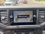 a picture of a car dashboard with a map on the screen
