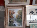 three framed pictures of ducks and swans are on display in front of a red wall