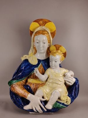 an image of a figurine of a woman holding a child