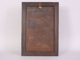 an old wooden picture frame hanging on a white wall