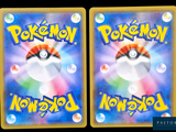 two cards with pokemon on them on a black background