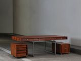 a wooden bench sitting in the middle of a room