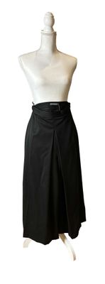 a picture of a mannequin with a black skirt on a mannequin stand
