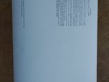 a piece of paper on a table with a pen on it