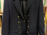 navy blue blazer with gold buttons on the lapel and gold buttons on the lapel and gold buttons on the lapel and gold buttons on the lapel