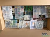 a cardboard box filled with many different types of electronics