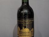 a bottle of wine that is sitting on a wooden table
