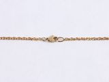 a gold chain bracelet with a star charm on a white background