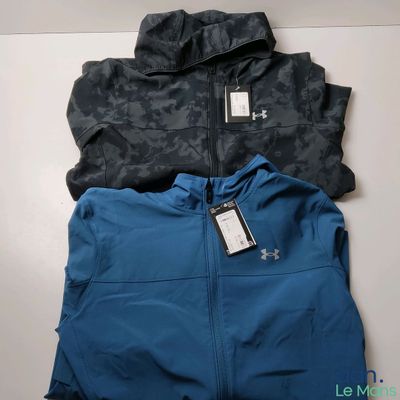 two men ' s under armour jackets, one blue and the other black