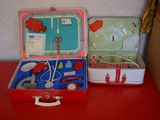 two suitcases that are sitting on a red table
