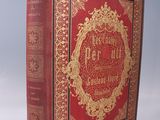 un vieux livre à la couverture rouge, orné d'une inscription dorée