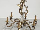 an image of a chandelier made of brass and glass