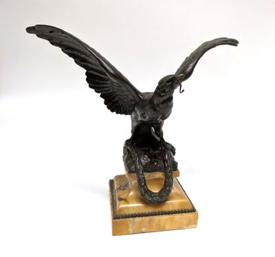 statue of an eagle on a marble base on a white background