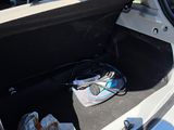 the trunk of a car with a bunch of items in it