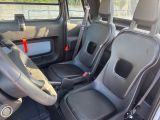 the interior of a car with two seats and a steering wheel